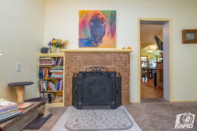 tiled living room with a chandelier