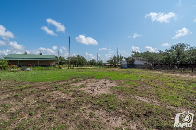 view of yard with a rural view