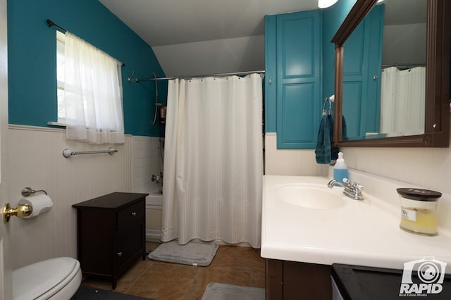 full bathroom with vanity, shower / tub combo, tile patterned floors, and toilet