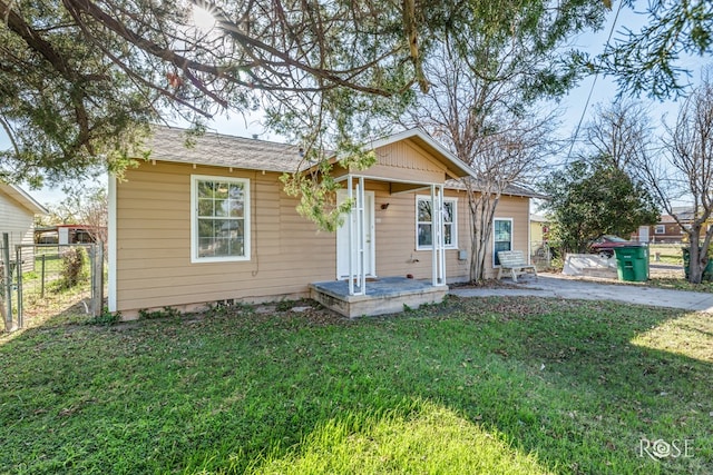 bungalow with a front yard