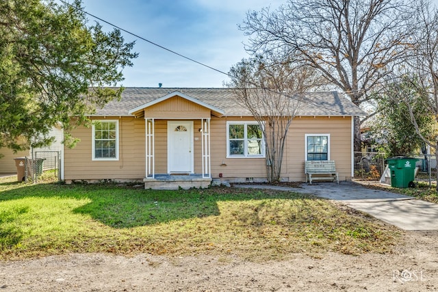 bungalow-style house with a front lawn