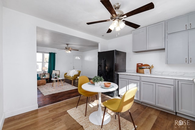 dining space featuring hardwood / wood-style flooring and ceiling fan