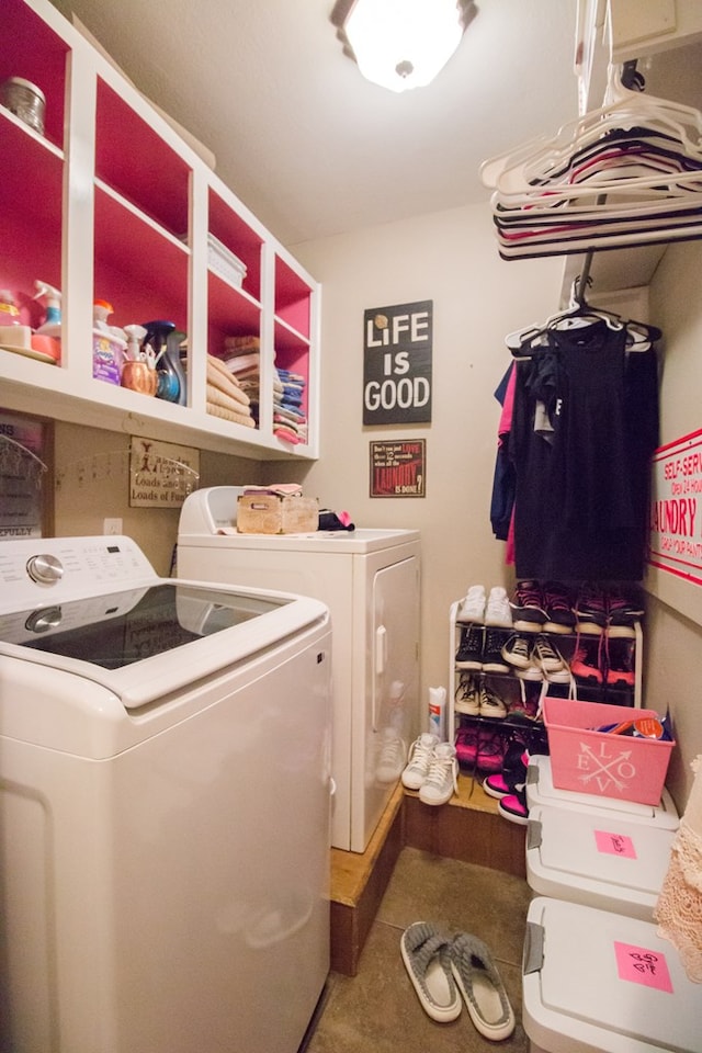 clothes washing area with laundry area and washer and clothes dryer