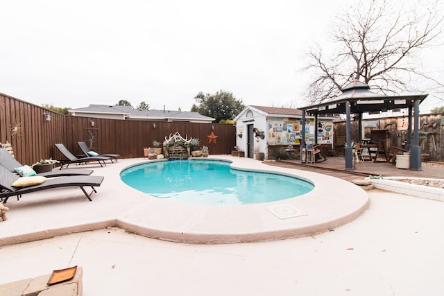 view of pool with a fenced in pool, a gazebo, a patio area, a fenced backyard, and an outdoor structure