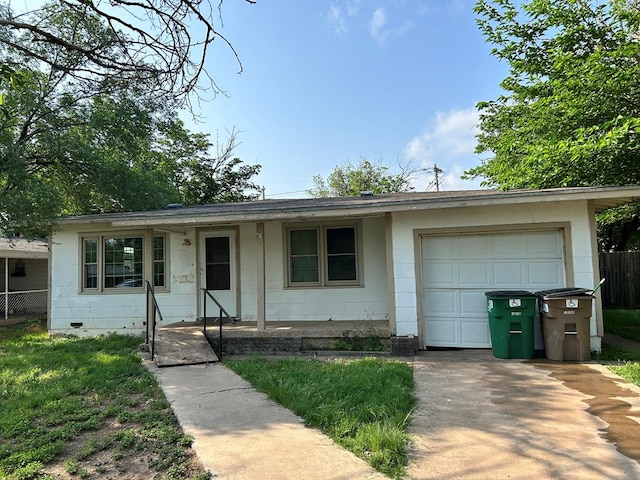 ranch-style home featuring fence, concrete driveway, and an attached garage