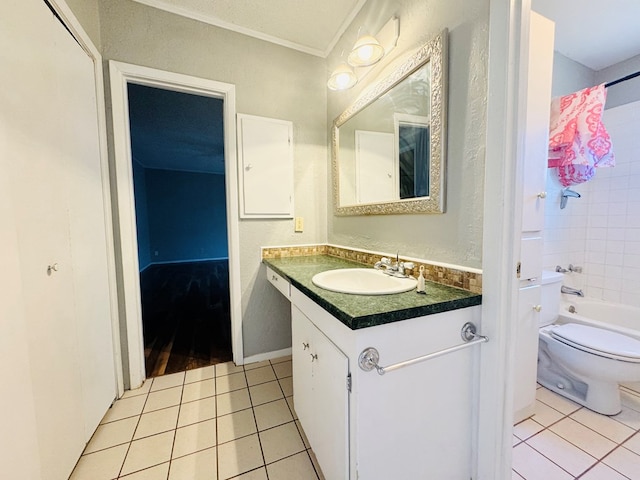 bathroom with vanity, shower / washtub combination, tile patterned flooring, and toilet