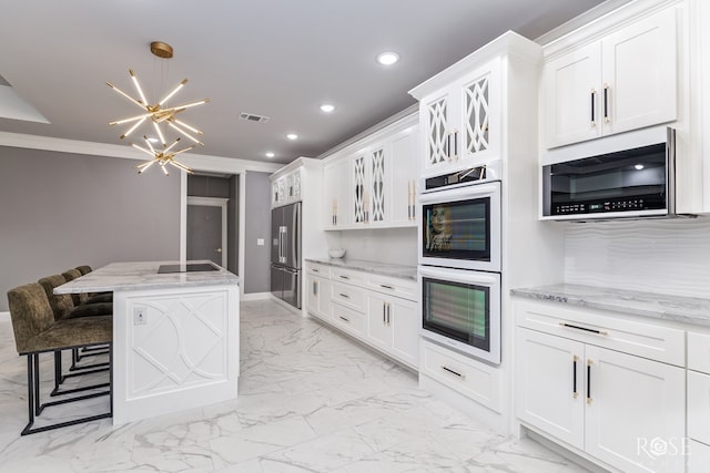 kitchen featuring marble finish floor, tasteful backsplash, visible vents, double oven, and high quality fridge