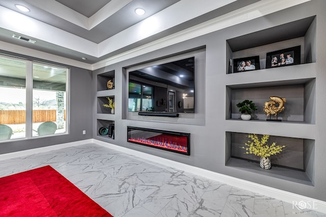 living room featuring built in features, marble finish floor, visible vents, a glass covered fireplace, and baseboards