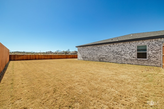 view of yard featuring a fenced backyard