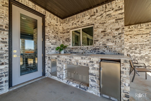 view of patio / terrace featuring a sink and area for grilling