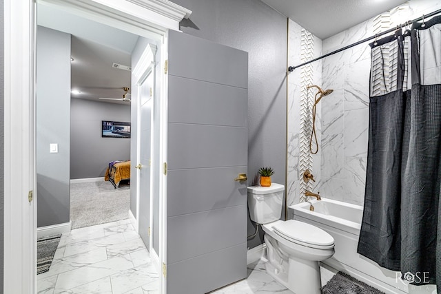 full bathroom featuring shower / bath combination with curtain, marble finish floor, baseboards, and toilet