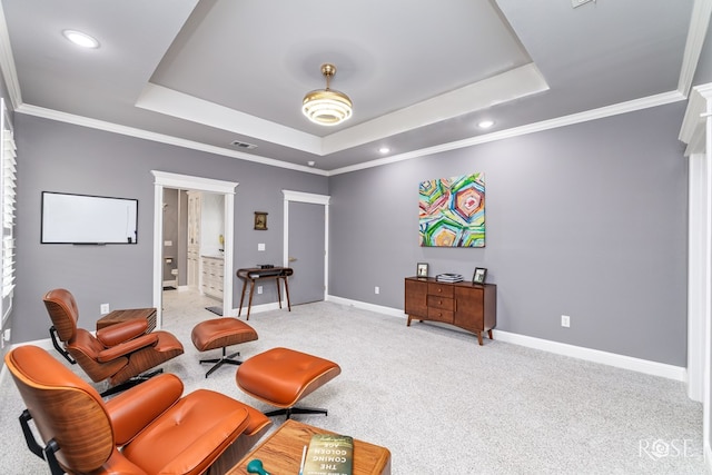 sitting room featuring a tray ceiling, light colored carpet, crown molding, and baseboards