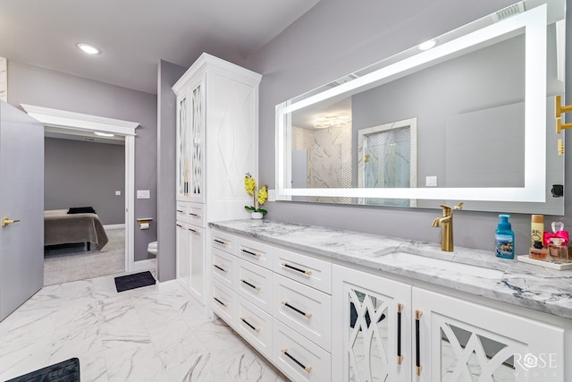 bathroom featuring toilet, recessed lighting, vanity, baseboards, and marble finish floor