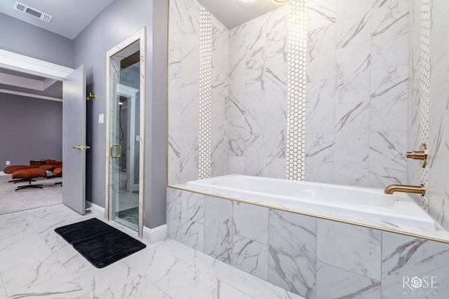 bathroom with marble finish floor, a shower with shower door, visible vents, and tiled bath