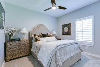 bedroom with carpet and ceiling fan