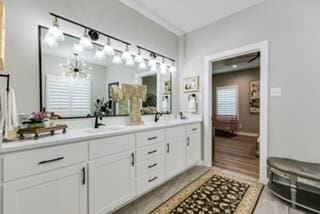 bathroom featuring vanity and an inviting chandelier