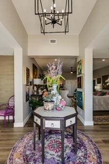 interior space featuring hardwood / wood-style flooring and an inviting chandelier