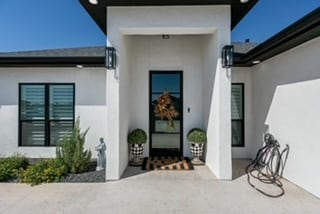 doorway to property featuring a patio