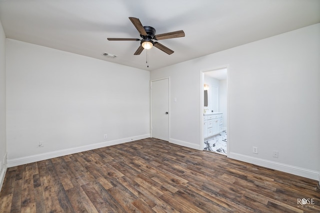 unfurnished bedroom with ceiling fan, dark hardwood / wood-style floors, and ensuite bath