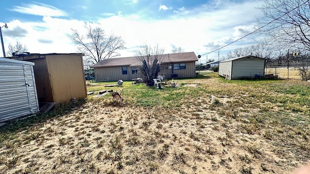 view of yard featuring a storage shed and an outdoor structure