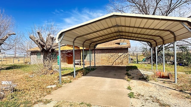 view of vehicle parking with a carport