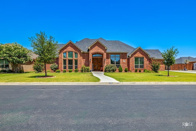 4710 Shadow Crk, San Angelo, TX 76904 - traditional home with brick siding and a shingled roof