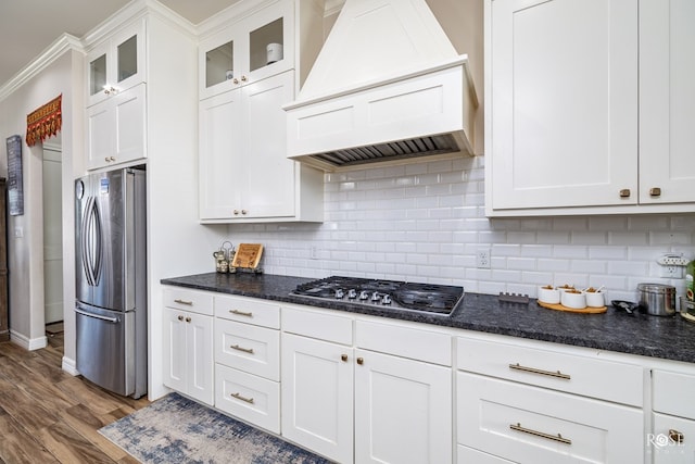 4710 Shadow Crk, San Angelo, TX 76904 - kitchen featuring stainless steel appliances, custom exhaust hood, white cabinetry, dark wood-style floors, and backsplash