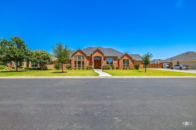 4710 Shadow Crk, San Angelo, TX 76904 - traditional home featuring a front yard and brick siding