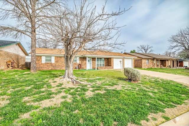 ranch-style home with a garage and a front yard