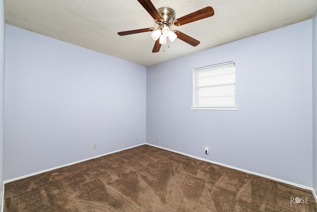 unfurnished room featuring dark colored carpet, ceiling fan, and a textured ceiling