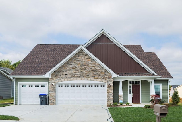 craftsman-style house featuring a front yard and a garage