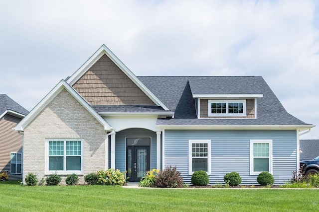 view of front of property with french doors and a front yard