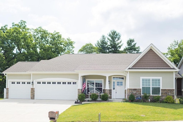 craftsman-style house featuring a garage and a front yard