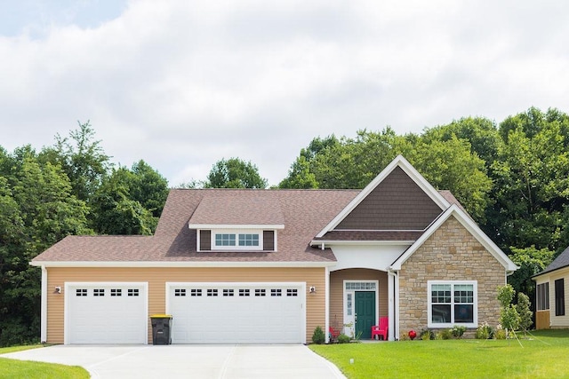 view of front of home with a garage and a front yard