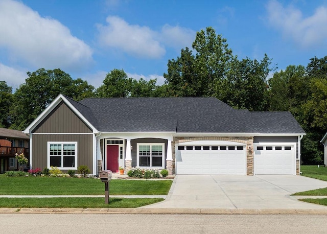 view of front of property with a garage and a front yard