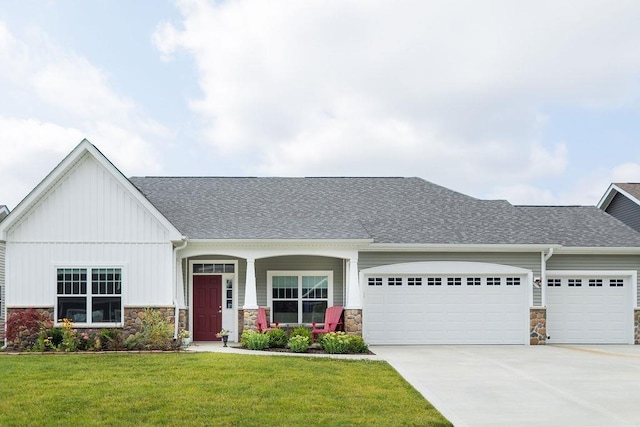 view of front of property with a garage and a front yard