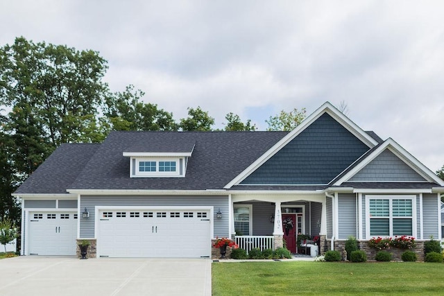 craftsman-style house with a porch, central AC, and a front lawn