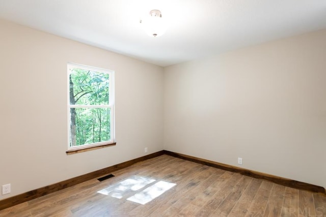 unfurnished room with plenty of natural light and light wood-type flooring