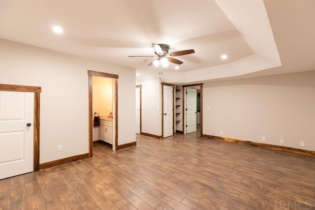 unfurnished room with ceiling fan and dark hardwood / wood-style floors