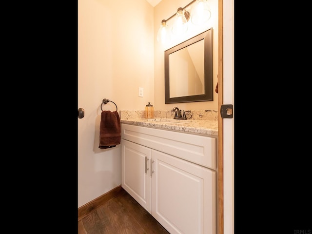 bathroom featuring vanity and hardwood / wood-style floors