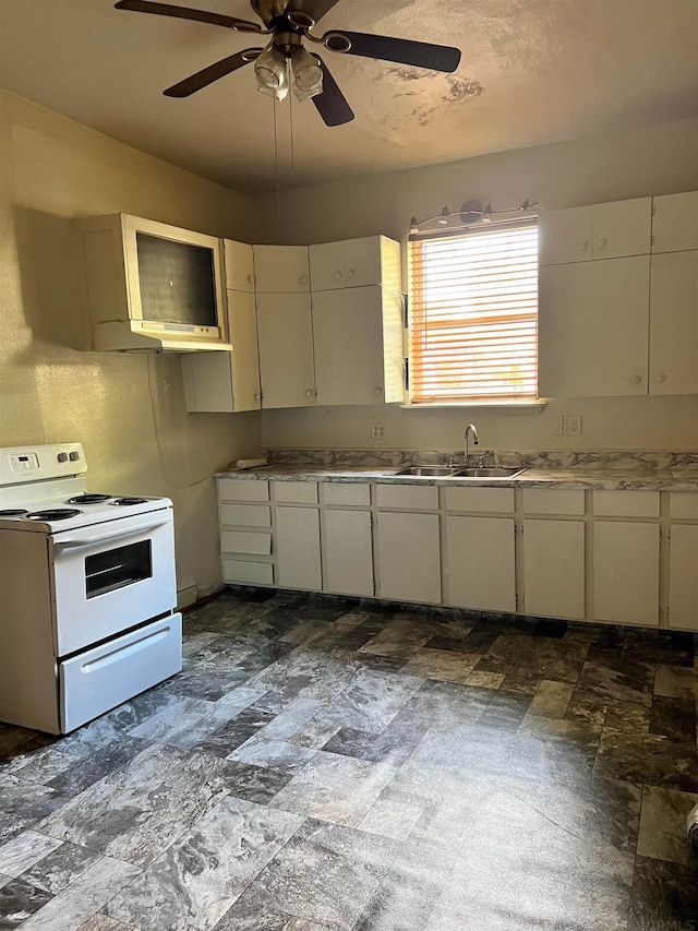 kitchen with electric stove, dark tile flooring, ceiling fan, and sink