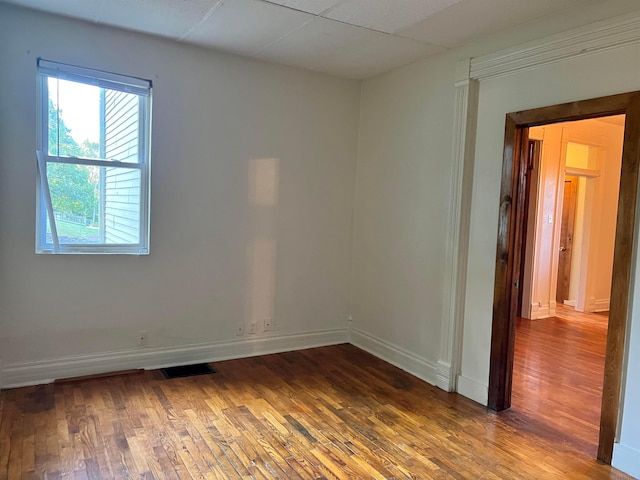 unfurnished room featuring wood-type flooring