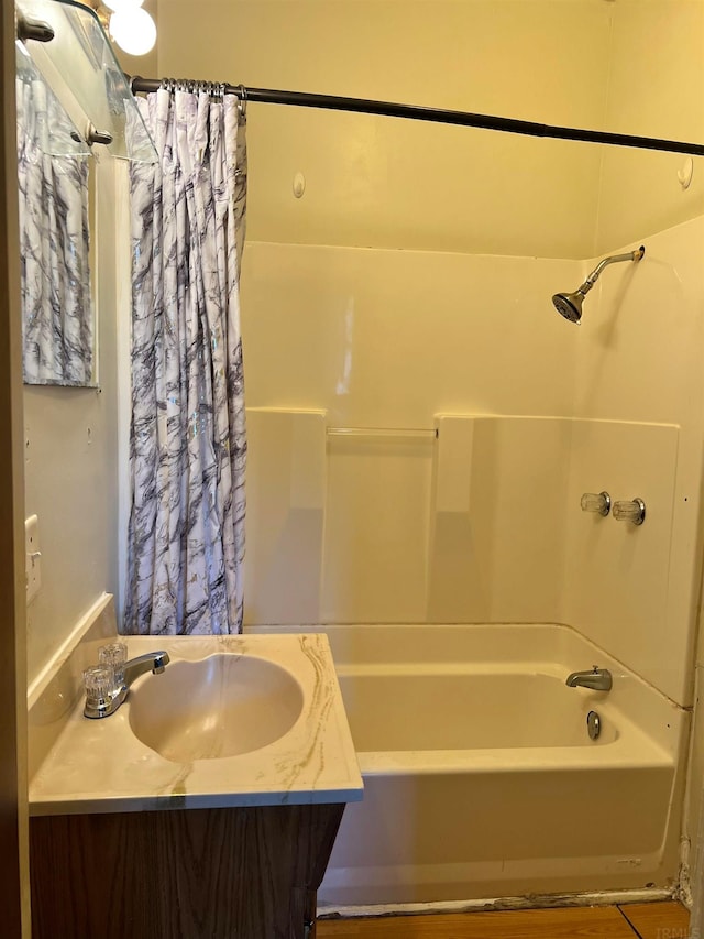 bathroom with shower / bathtub combination with curtain and vanity