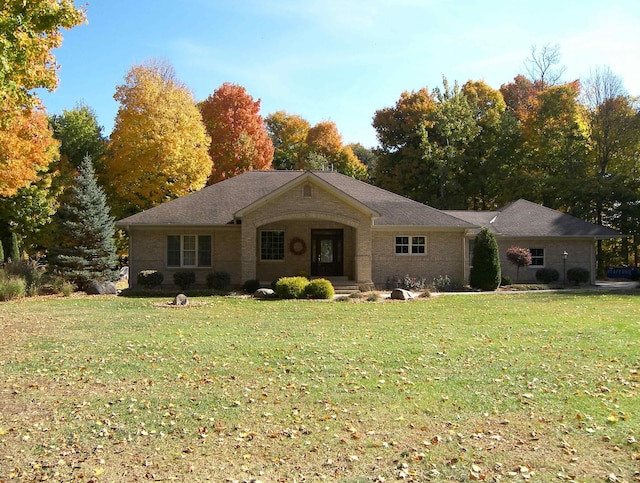 single story home with a front lawn