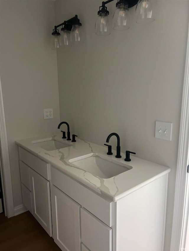 bathroom with vanity and hardwood / wood-style floors