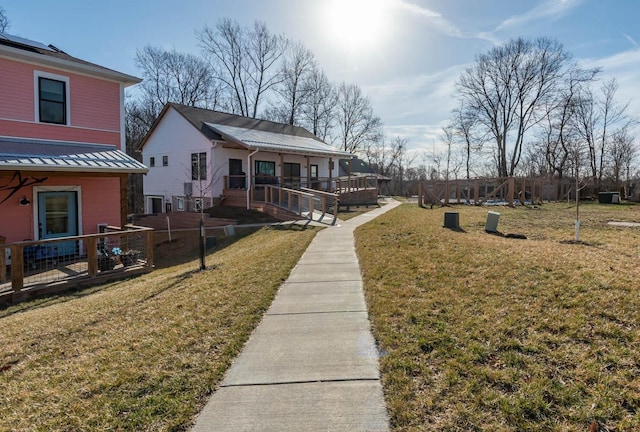 rear view of house with a yard