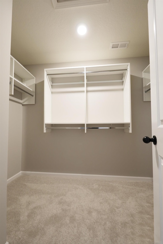 walk in closet with carpet flooring and visible vents