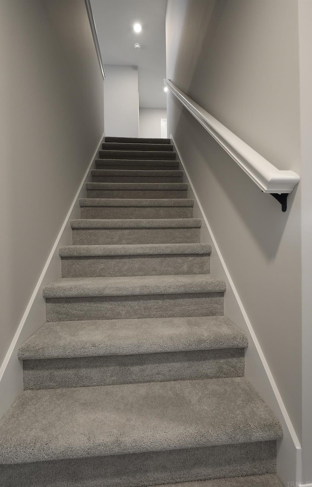 stairway featuring recessed lighting