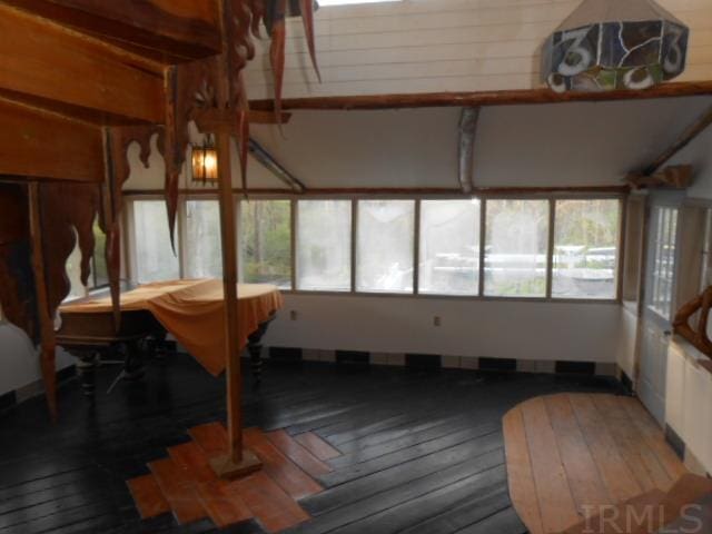 dining area with dark hardwood / wood-style flooring