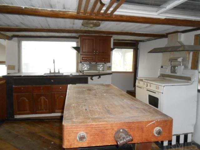 kitchen featuring white electric range oven, wall chimney range hood, beam ceiling, dark hardwood / wood-style floors, and sink